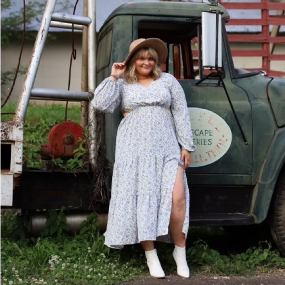 Boutique blue and white floral long sleeve dress with slit.